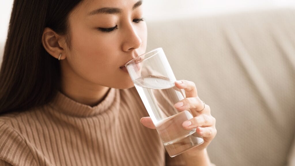 Girl Drinking Clean Mineral Water from Glass